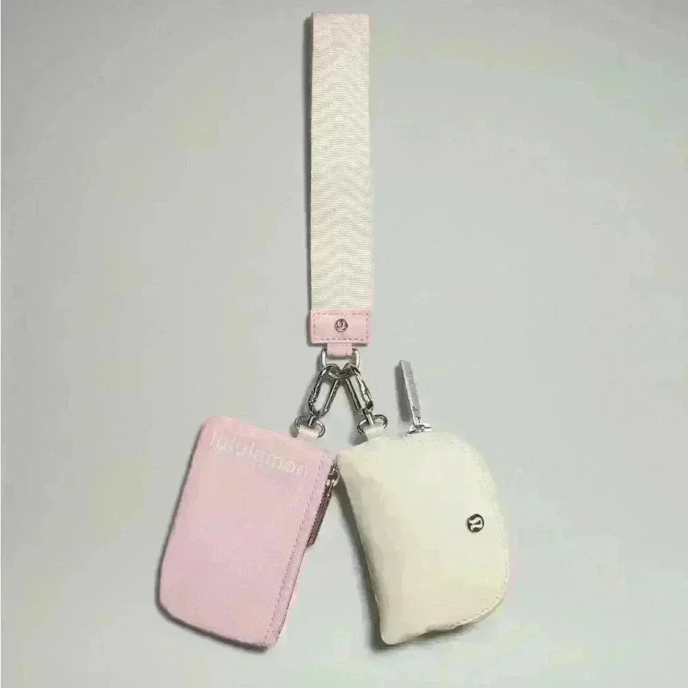 Lululemon 💕 Dual Pouch Wristlet in SOLD OUT color White Opal/ Pink preppy bag